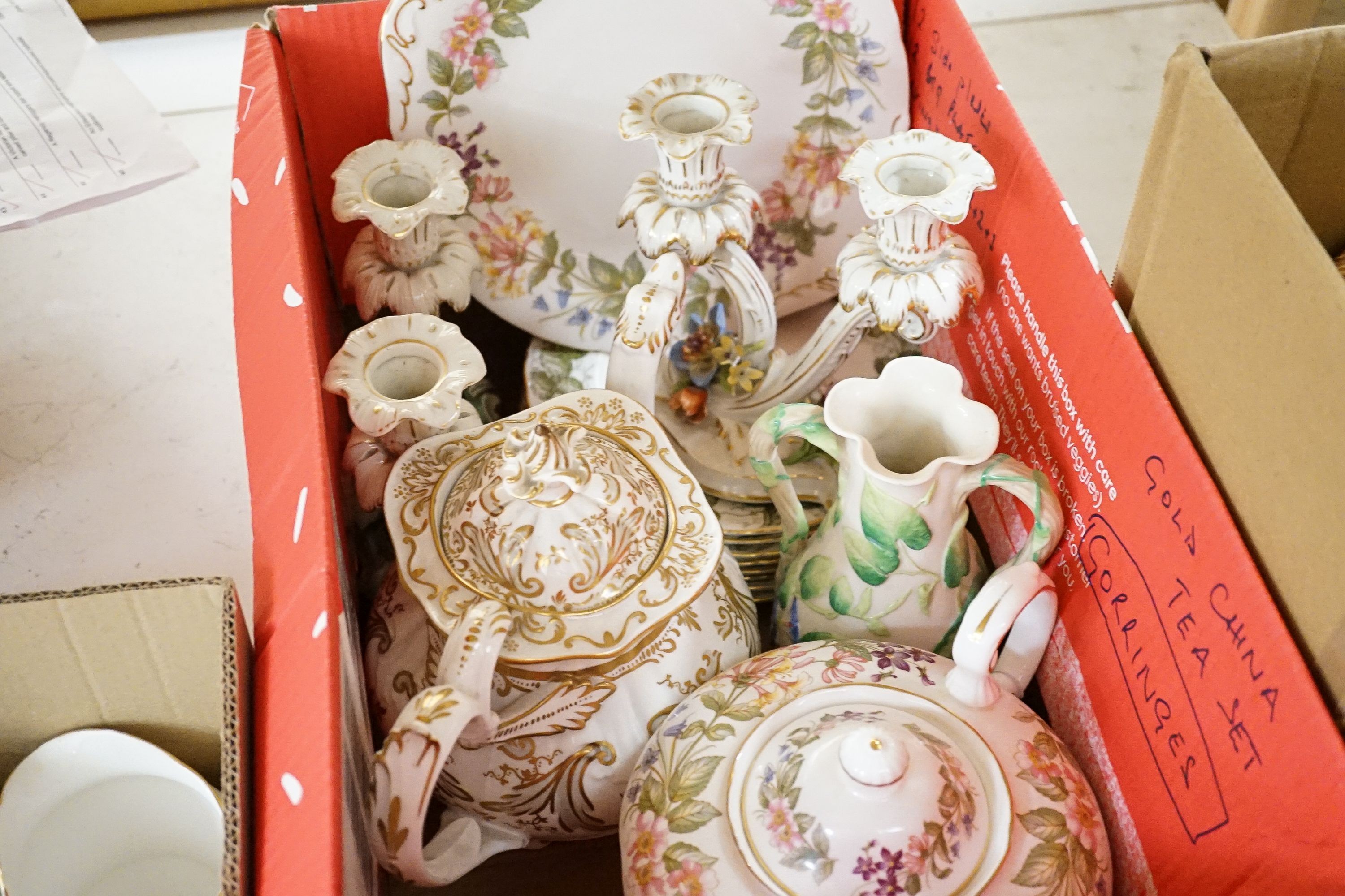 A Crown Staffordshire fifty nine piece part tea set and dessert service, central flowers and gilt borders, a Paragon part tea set and other ceramics